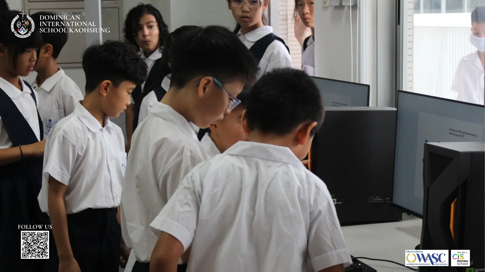 DISK students exploring computers in a new-campus learning space