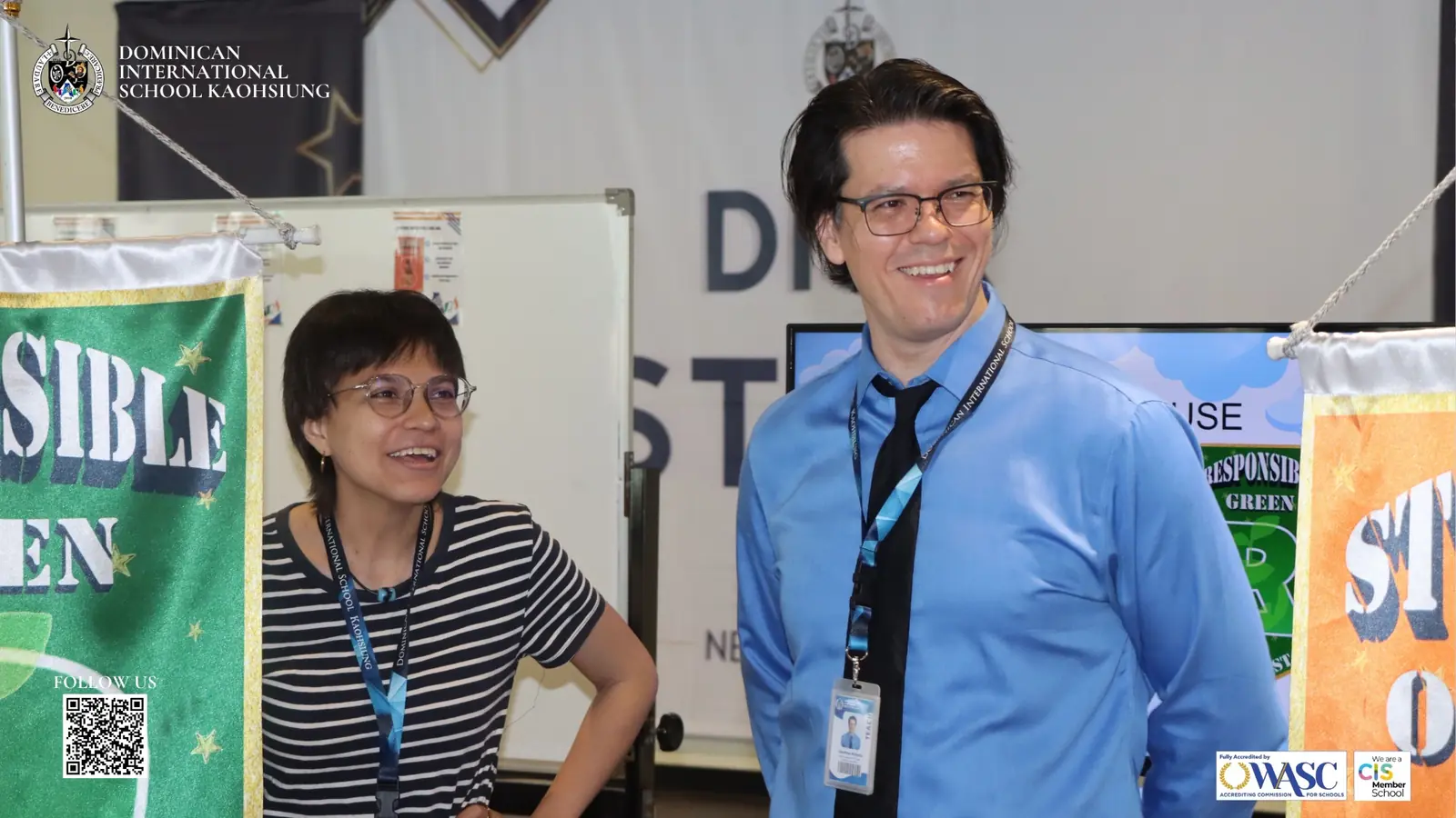 DISK teachers standing beside STARS team banners during the opening program