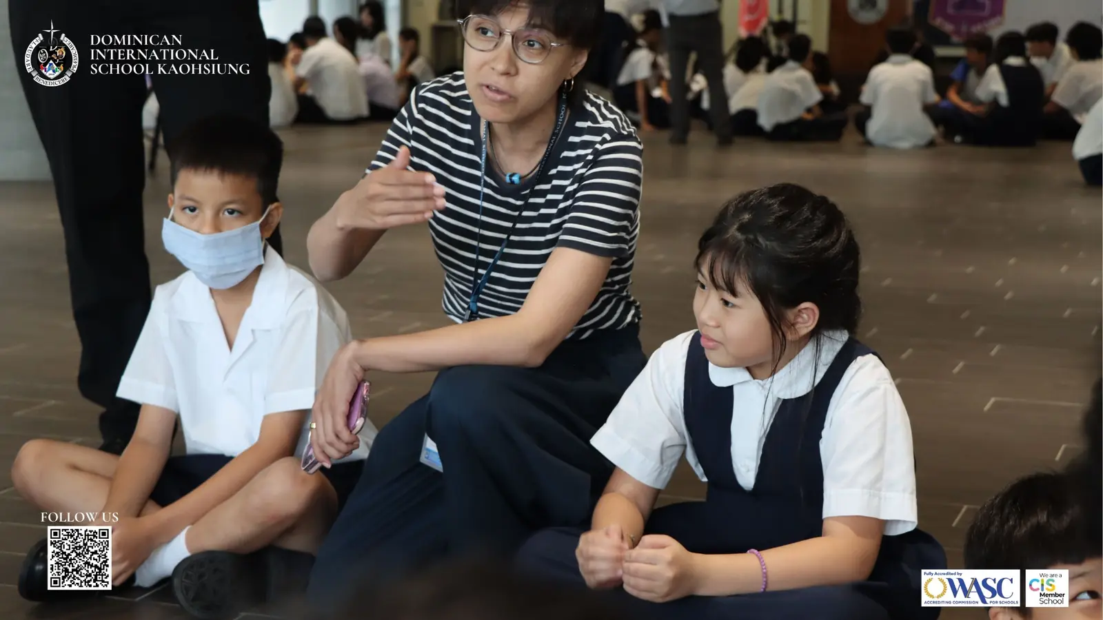 A teacher guiding DISK students during a small-group welcome activity